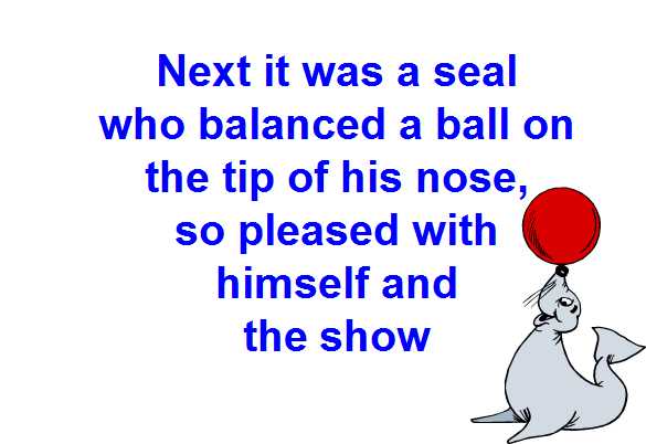 happy seal balancing a red ball on his nose